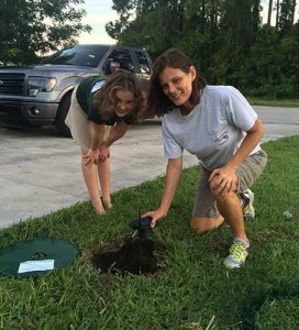 Stephanie Robb, right, serves as vice president of South Florida Gas. She and her daughter Elizabeth are pictured with one of the company’s tank monitors.