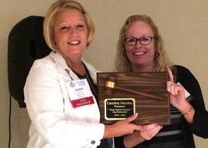 Incoming President Karen Elliott presenting a plaque of appreciation to Outgoing President Caroline Hensley. Photo courtesy of WVPGA.