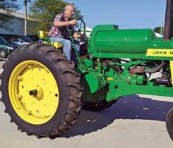 Young test-drives a propane-fueled John Deere tractor.Photos courtesy of Superior Energy Systems, Don Hunsberger, and by Megan Smalley