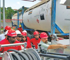 Clark, far right, working in the Caribbean during a bobtail training event. He says working in the propane industry has taken him around the world. Photo courtesy of Tom Clark