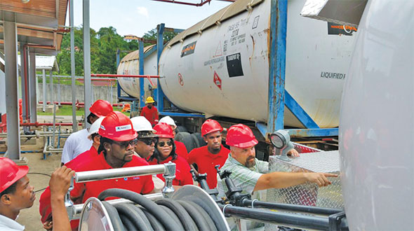 Clark, far right, working in the Caribbean during a bobtail training event. He says working in the propane industry has taken him around the world. Photo courtesy of Tom Clark 