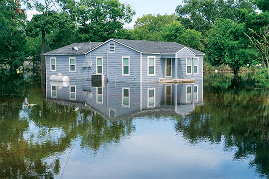 A home propane system, at left, submerged in floodwater. Photo Courtesy of Logica3