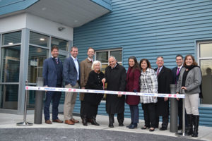 Andy Gilburg, from left, of Benchmark Construction; Luke Senkowski of Rhoads Energy; Lyle Holster of EDC Finance; Faye and Mike DeBerdine of Rhoads Energy; Danene Sorace, Mayor of Lancaster City; Jennifer Goldbach of Rhoads Energy; Tom Baldrige of the Lancaster Chamber; Richard Mula of Richard F. Mula Architects; and Cheryl Love of ELA Group take part in the ribbon cutting ceremony for the Rhoads headquarters. Photo courtesy of Rhoads Energy