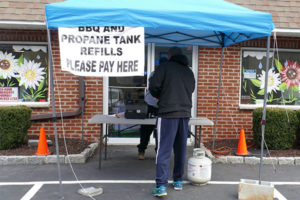 Depew Energy set up a tent outside its office to service customers during the coronavirus pandemic. Photo by Roger Rosenbaum