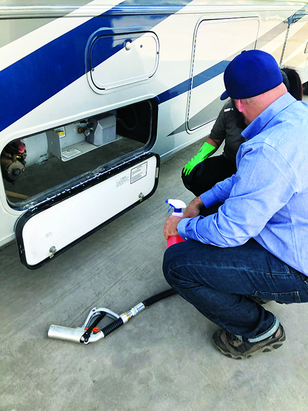 David Kennedy of Alliance AutoGas trains a U-Haul employee on how to fill an RV. Photo courtesy of U-Haul