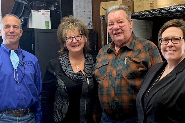 Company representatives involved with the purchase included, from left, Clay Adams, FEI vice president of operations; Julie and Rick Salvesen of Midwest Meter and MID:COM; and Christy Fliflet, FEI president and CEO. Photo courtesy of FEI