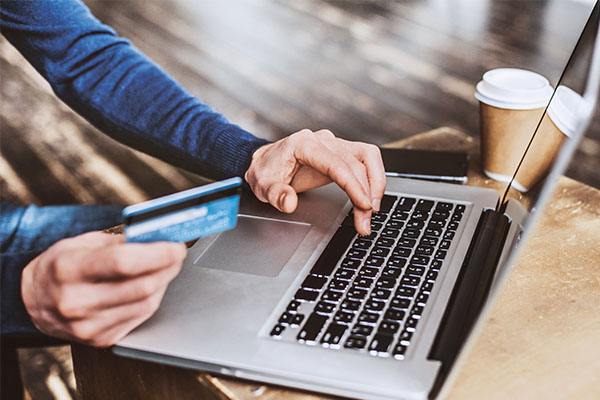 Online shopping is keeping sales of merchandise afloat while many service businesses suffer. Photo: Poike/iStock / Getty Images Plus/Getty Images