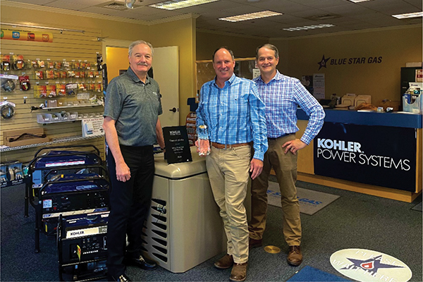 Kohler representative Jeff Anderson (left) presents Kohler's Dealer of the Year – West Region award to Blue Star Gas President Jeff Stewart (center) and Director of Power Division Mark Leitman. Photo by C Reddoor