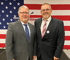 James Ellis, right, stands with John Whittington, vice president of legislative affairs at Grammer Logistics. Photo by Grammer Logistics