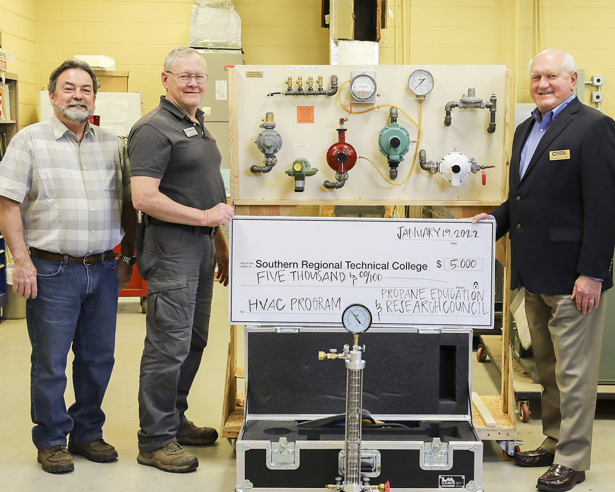 Dan Richardson of Conger LP Gas, right, presents the Southern Regional Technical College with a $5,000 grant from the Propane Education & Research Council. (Photo courtesy of Southern Regional Technical College)