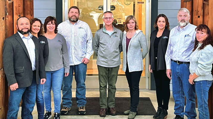 Energy Partners’ senior leadership team, from left: DeWayne O’Brien, Bridget Mentel, Paula Lemmon, Tucker Eslinger, Bob Dube, Debbie Dube, Amber Stark, Michael Henry and Kim Job. (Photo by DeWayne O’Brien)