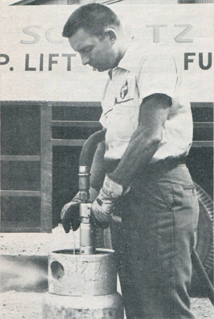 Photo of Don Schultz filling a forklift cylinder