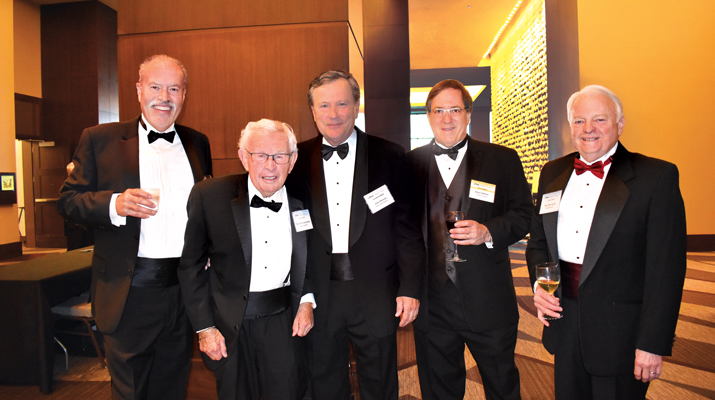 The dinner draws leaders from the propane industry, including past Hall of Famers Darrel Reifschneider, second from left, and Ray Murray III, right. (Photo by LP Gas staff)