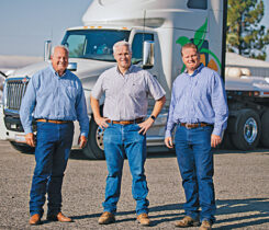 From left, John Fisher IV stands with his sons Matt and John. (Photo courtesy of Crop Management Co.)