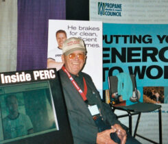 Milford Therrell is appropriately surrounded by the trade show materials of PERC, the council he worked to form.
