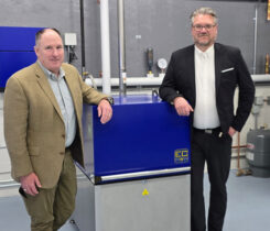Jeff Stewart of Blue Star Gas, left, and Anders Thorsen of EC Power celebrate the distributor agreement the companies signed. (Photo courtesy of EC Power)