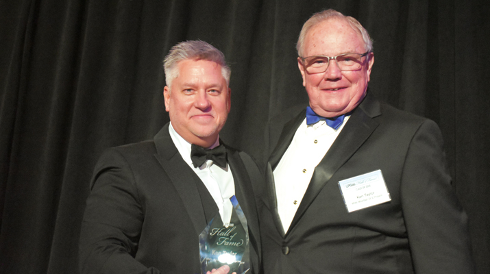 LP Gas Publisher Brian Kanaba presents inductee Ken Taylor with his plaque. (Photo by LP Gas staff)