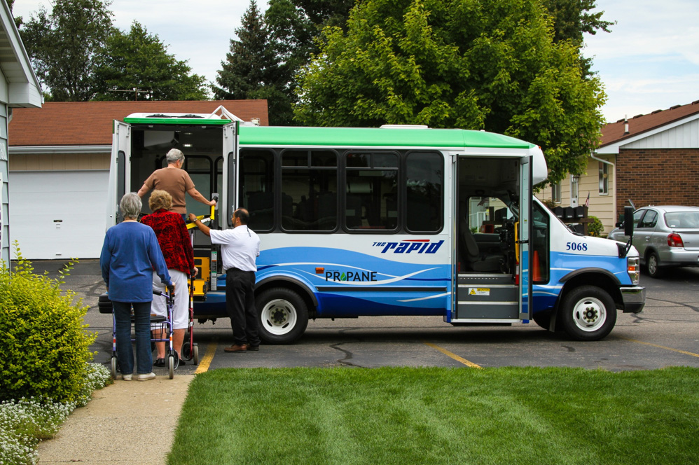 Photo of people boarding a propane-fueled transit bus.