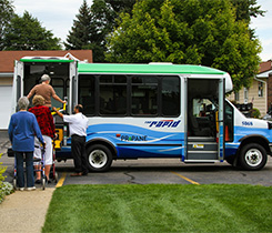 Photo of people boarding a propane-fueled transit bus.