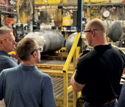 David Graham, right, takes LP Gas’ Brian Kanaba, left, and Brian Richesson on a company tour in Fremont, Ohio. (Photo by Shirnae Richardson)