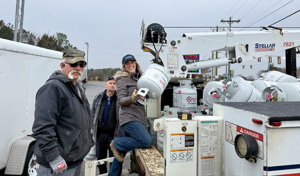 Photo of volunteers helping with donated propane cylinders