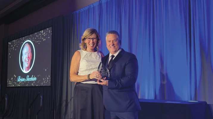 Kanaba presents RCC founder Brian Sheehan’s award to his sister, Susie Kuznia. (Photo by LP Gas Staff)