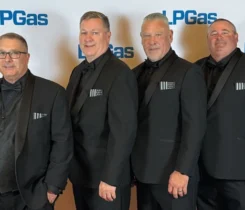 Newport Propane team members attended the LP Gas Hall of Fame dinner the night before helping a young man in downtown Nashville. From left are Rick Francis, Tom Watson, Donnie Pelletier and Peter Sherman. (Photo: LP Gas Staff)