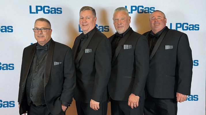 Newport Propane team members attended the LP Gas Hall of Fame dinner the night before helping a young man in downtown Nashville. From left are Rick Francis, Tom Watson, Donnie Pelletier and Peter Sherman. (Photo: LP Gas Staff)
