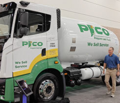 Photo of Christopher Hill of Pico Propane and Fuels and Gary Winemaster of Nexio Power Inc. walking beside a Nexio propane-fueled bobtail branded for Pico. (Photo courtesy of Nexio Power Inc.)