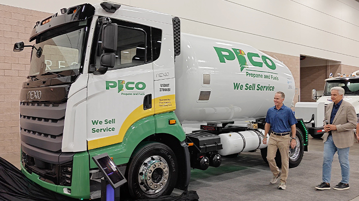 Photo of Christopher Hill of Pico Propane and Fuels and Gary Winemaster of Nexio Power Inc. walking beside a Nexio propane-fueled bobtail branded for Pico. (Photo courtesy of Nexio Power Inc.)